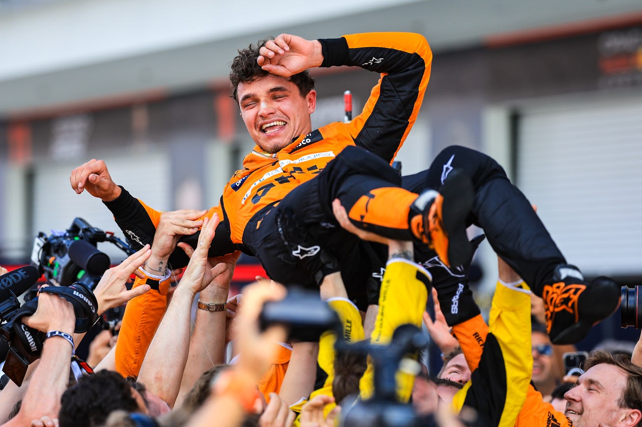 MIAMI, FLORIDA - MAY 5: Lando Norris of Great Britain and McLaren celebrates with the team in parc ...
